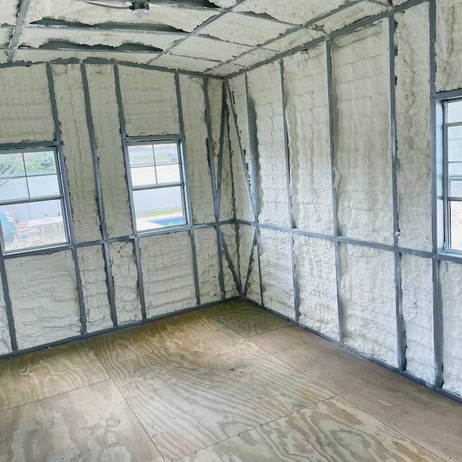 Closed-cell spray foam insulation applied to wall cavities in a residential project in Perry